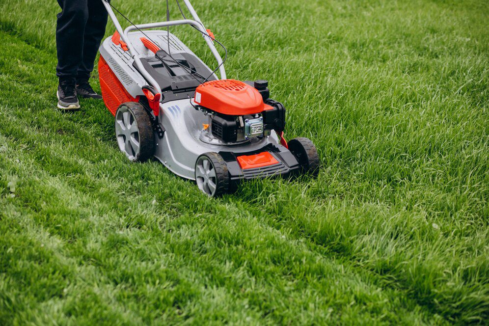 man-cutting-grass-with-lawn-mover